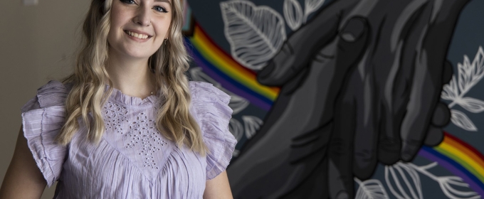 photo of woman with mural