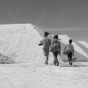 three people walking away from the camera