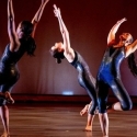 three women dancing on a stage