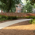 photo of sign on low brick wall