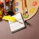 photo of palette, pen, mask, and instruments