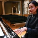 photo of woman playing piano, interior