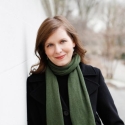 photo of woman outdoors, next to wall