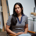 photo of woman seated in studio