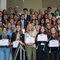 photo of large group of people holding certificates