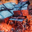 christmas presents surrounded by lights and garland