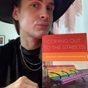 man holding book